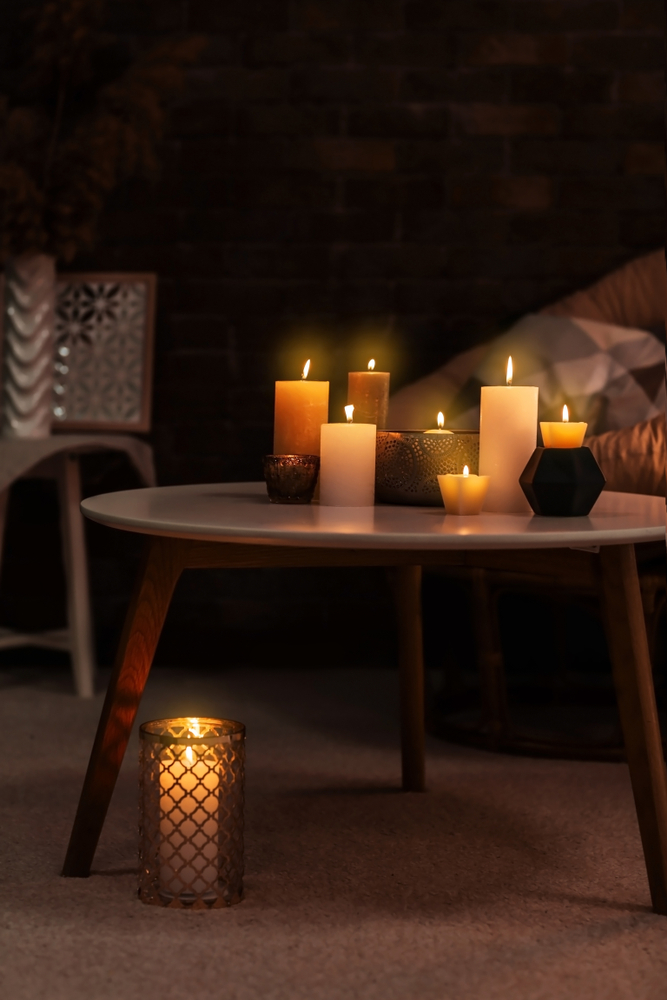 Burning,Candles,On,Table,Indoors