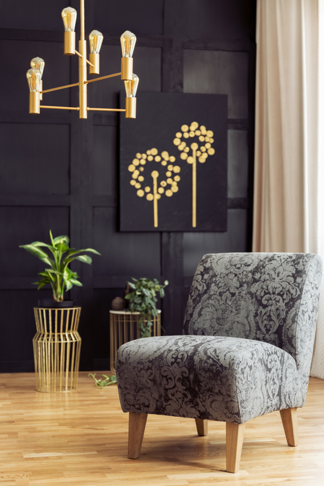 Patterned,Armchair,In,Dark,Living,Room,Interior,With,Chandelier,Above