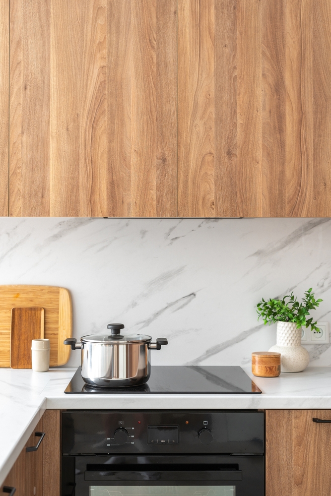 Wooden,Cabinets,In,Modern,Kitchen.,Vertical,Shot,Of,Stainless,Steel