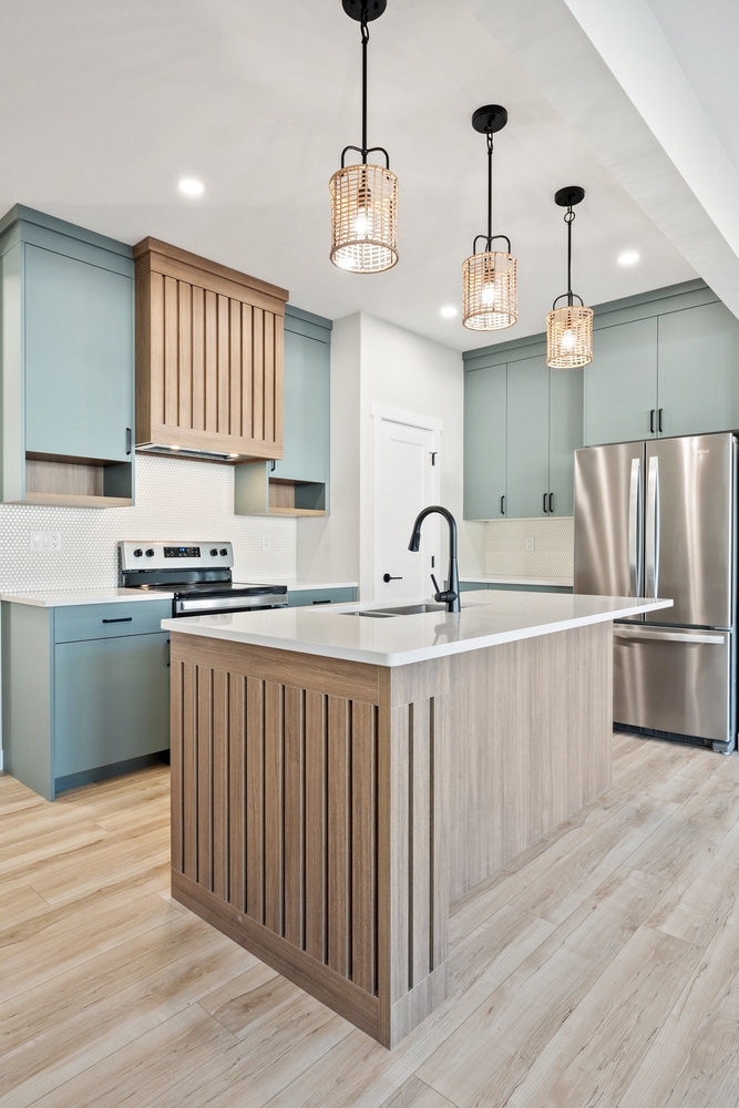Stylish,Kitchen,Featuring,Mint,Green,Cabinetry,,A,Wooden,Range,Hood,