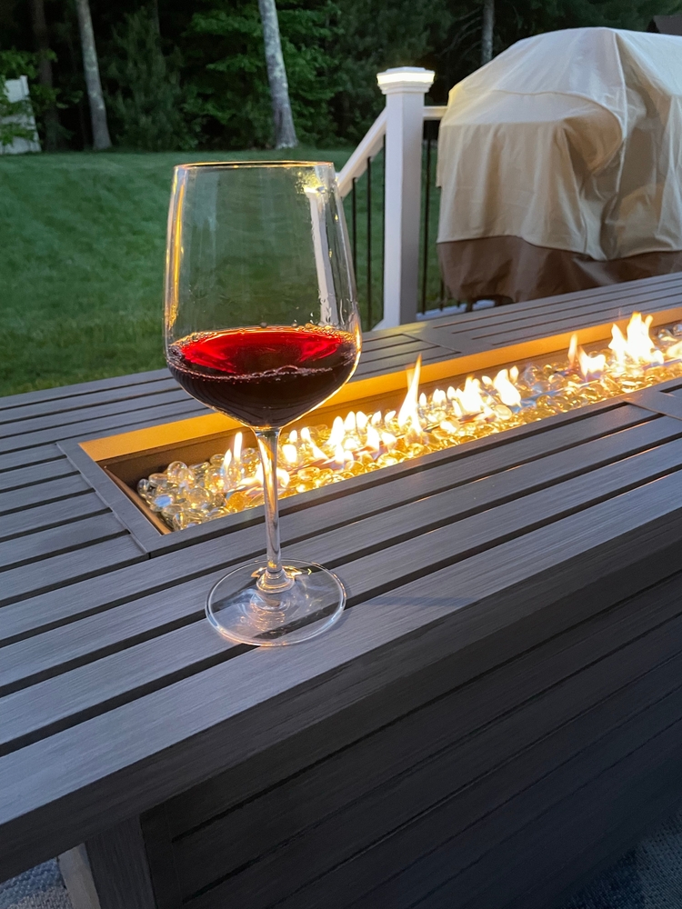 Glass,Of,Red,Wine,By,Modern,Fire,Pit,,Cozy