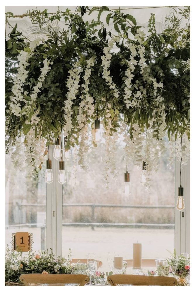 Romantic Pergola with Hanging White Blooms white flower garden ideas