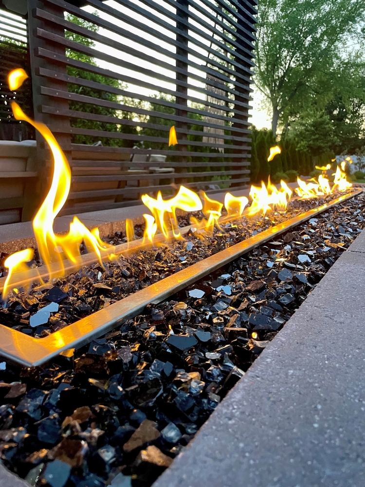 Stunning,Poolside,Gas,Fire,Pit,Filled,With,Black,Glass,Compliments