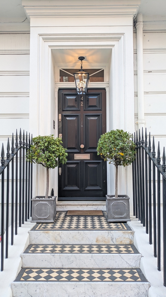 Classic,Georgian,Victorian,Black,Wooden,Door,With,Checkerboard,Tiles,,Potted