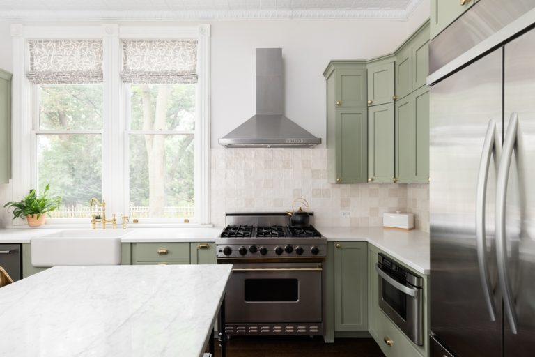 A,Kitchen,Detail,With,Sage,Green,Cabinets,,A,Gold,Faucet